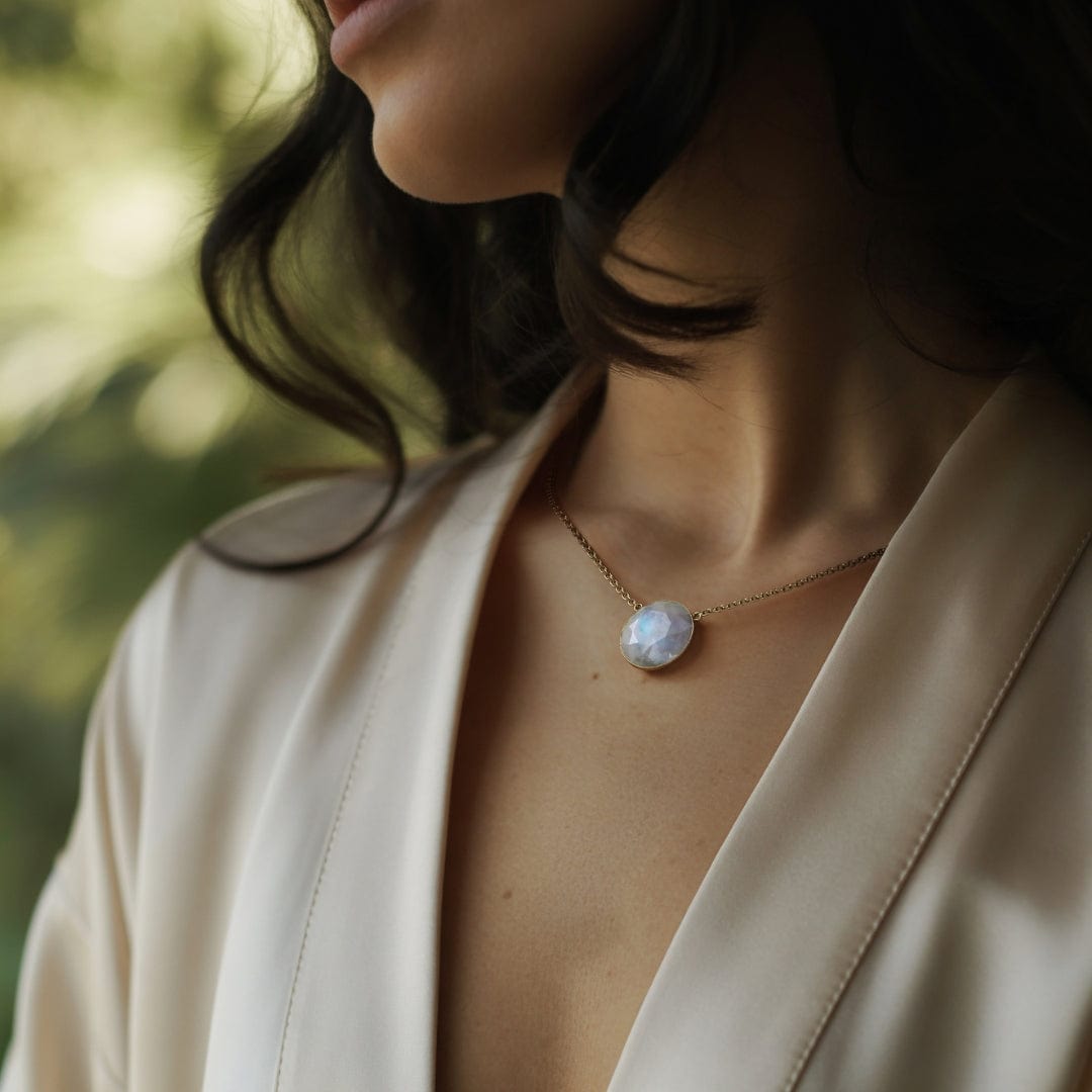 Woman wearing Daya's celestial moonstone necklace